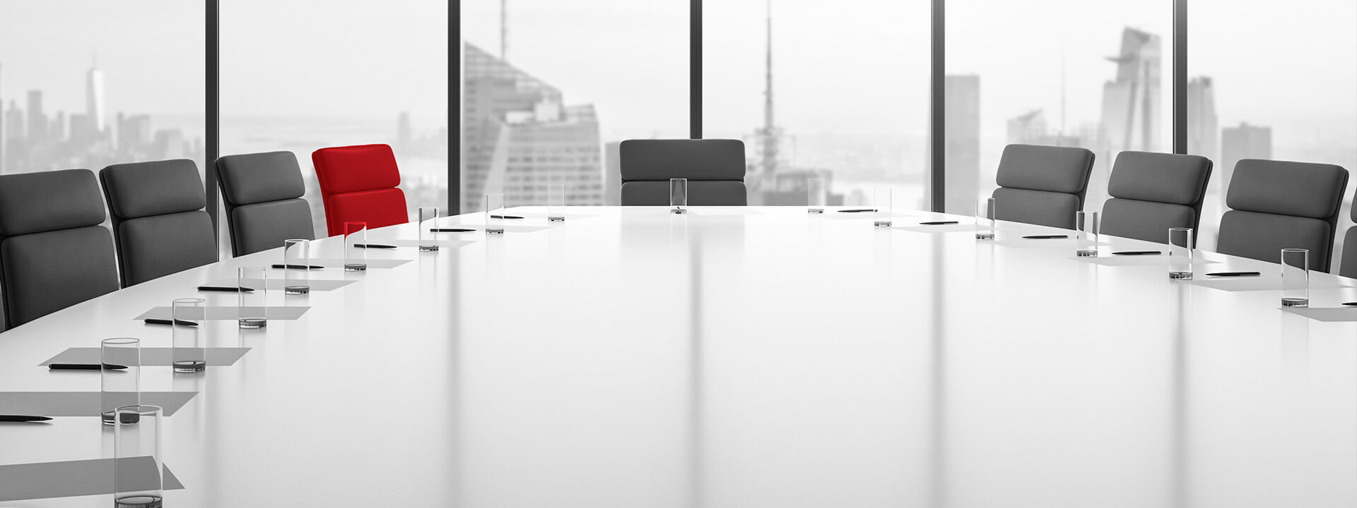 boardroom with large windows in tall office building