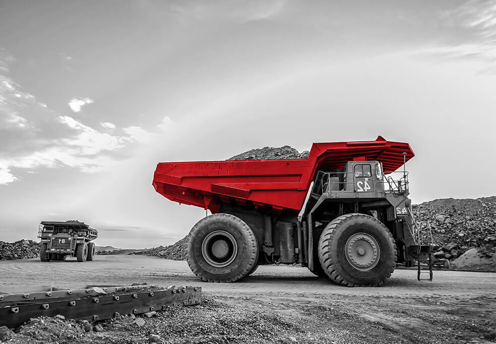 two mining trucks