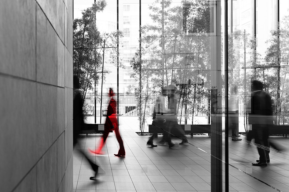 people walking in building entrance